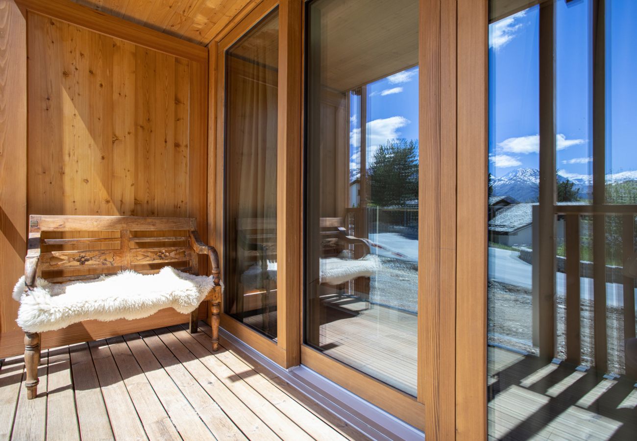Sunny balcony with bench and sheepskin in the fresh Engadine mountain air